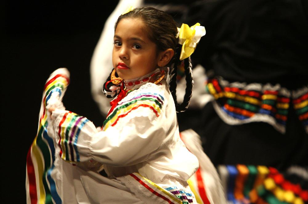 Jesy Cervantes danced as part of a World of Holidays celebration at the FedEx Express World Headquarters in Memphis, Tenn. on Tuesday, Dec. 6, 2011. Performers with a variety of cultural messages showed off their cultures in an effort to aid in the understanding of the many diverse cultures where FedEx employees work and live. (AP Photo/The Commercial Appeal, Karen Pulfer Focht)