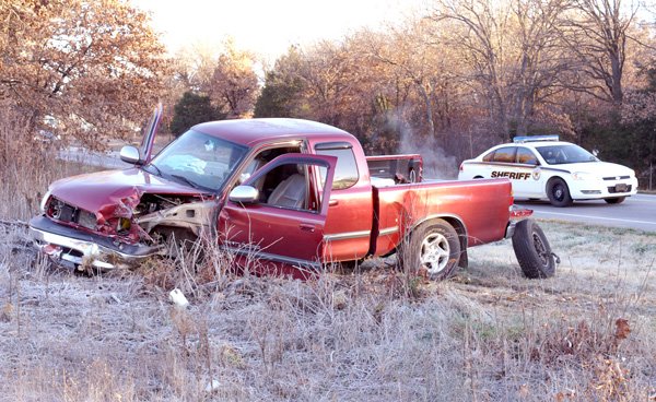 A wrecked Toyota pickup truck sets along the highway following a three-vehicle accident on Nov. 30. All three drivers were taken to the hospital following the crash.