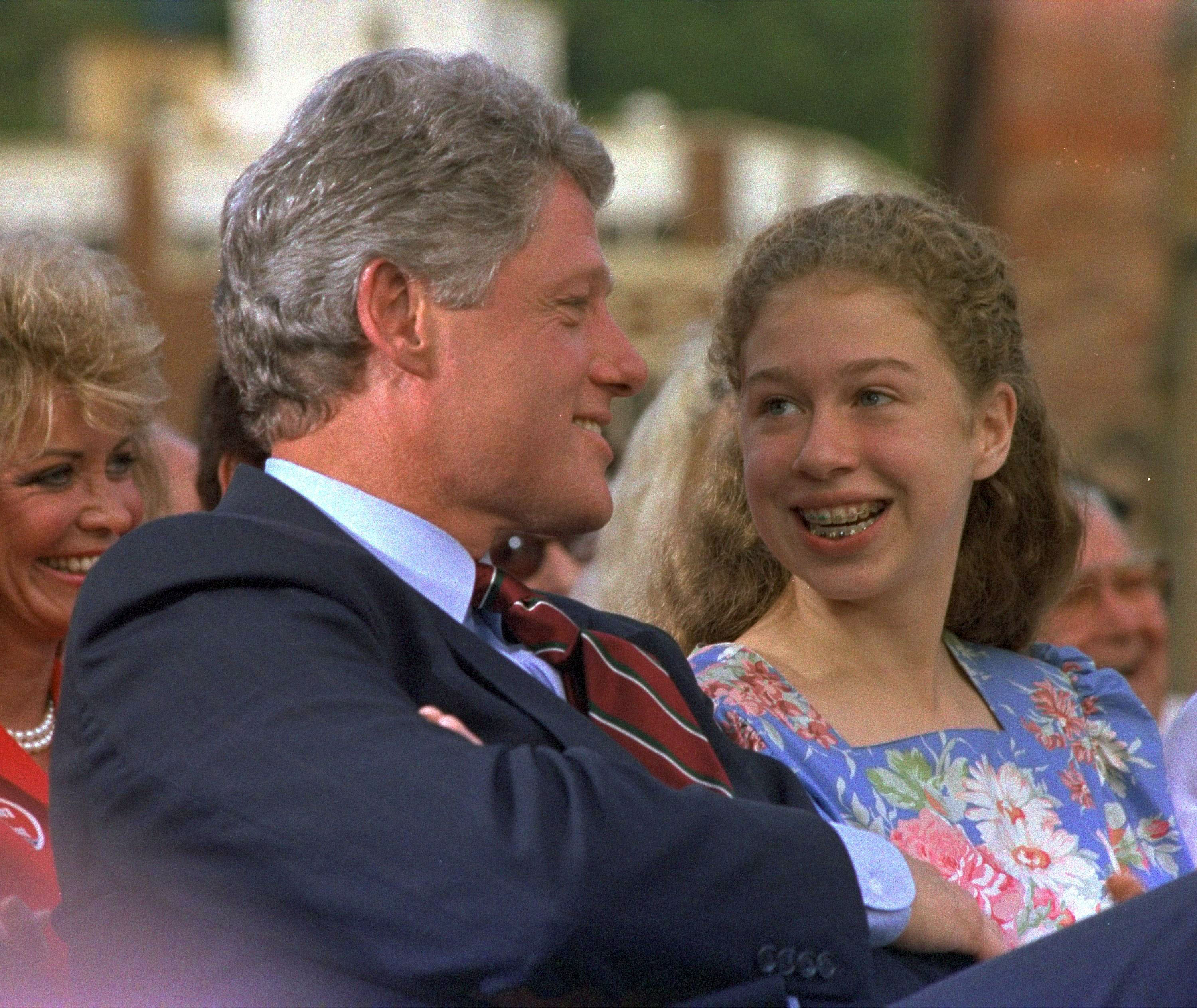 1992| Presidential candidate Bill Clinton talks with his daughter Chelsea, 12, before a rally in Hot Springs.