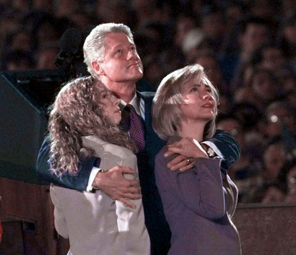 1996 | President Bill Clinton hugs daughter Chelsea and first lady Hillary Rodham Clinton as they watch fireworks during an election night rally in Little Rock.