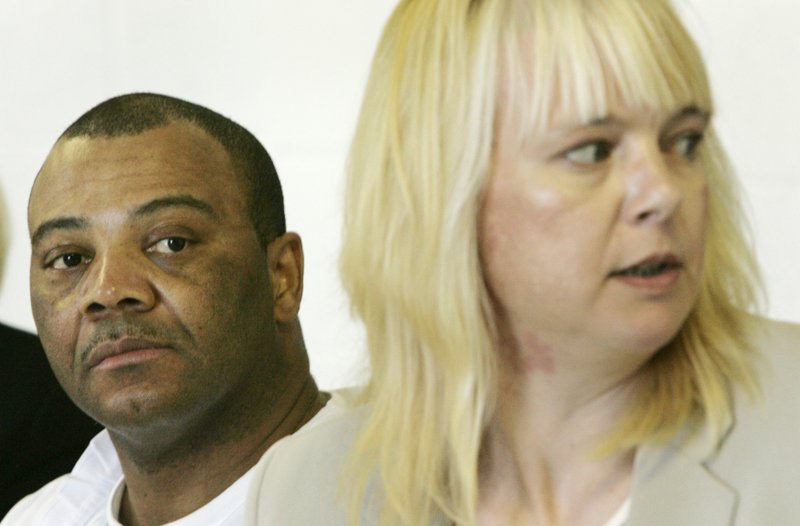 Arkansas death-row inmate Frank Williams Jr., left, listens to his attorney Julie Brain during a clemency hearing in Varner, Ark., Monday, Aug. 4, 2008.