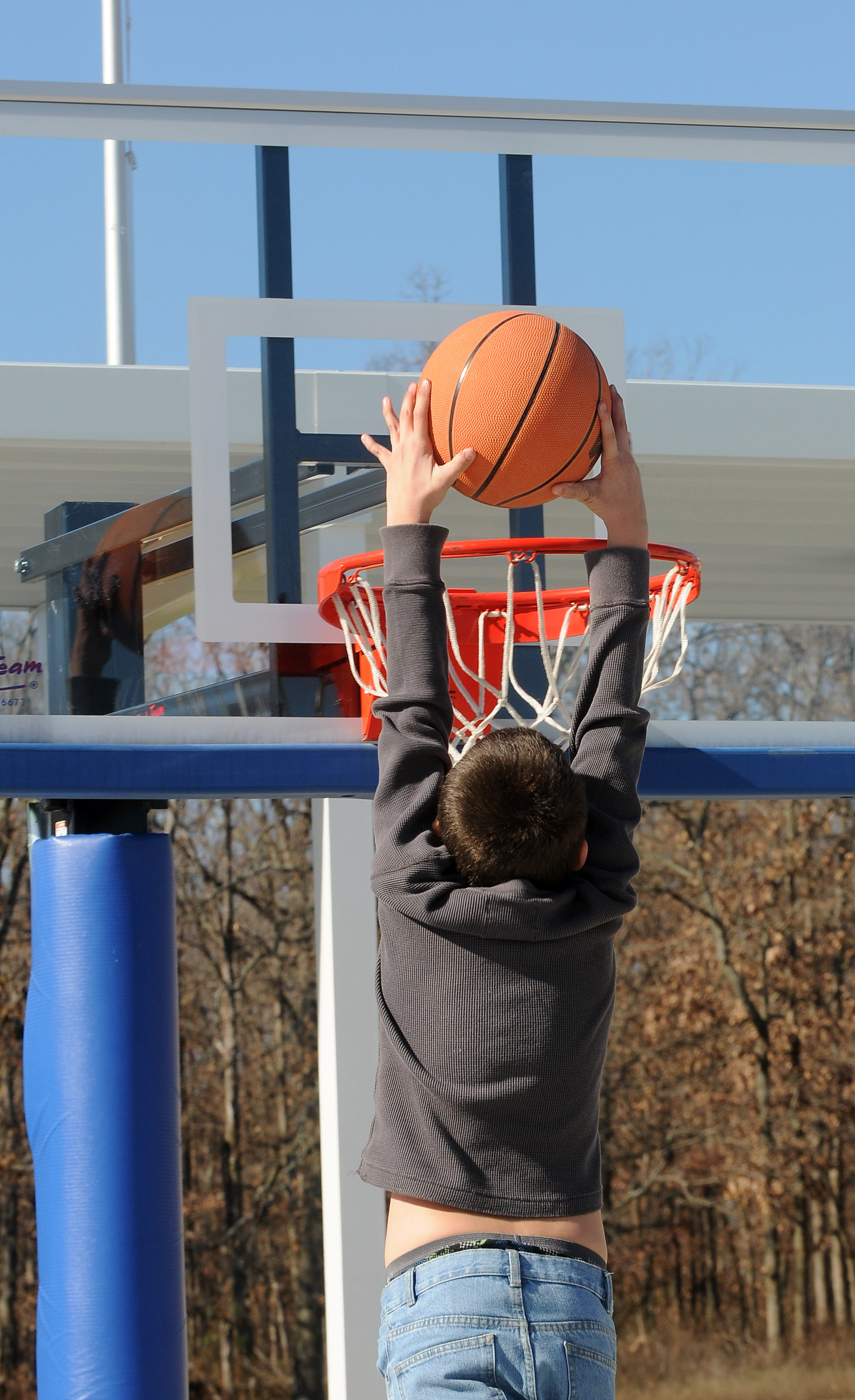 A child plays basketball Wednesday, Nov. 30, 2011, at the Northwest Arkansas Children's Shelter in Bentonville. Greg Russell, a spokesman for the shelter, said the shelter tries to provide as normal a routine as possible for the children.
