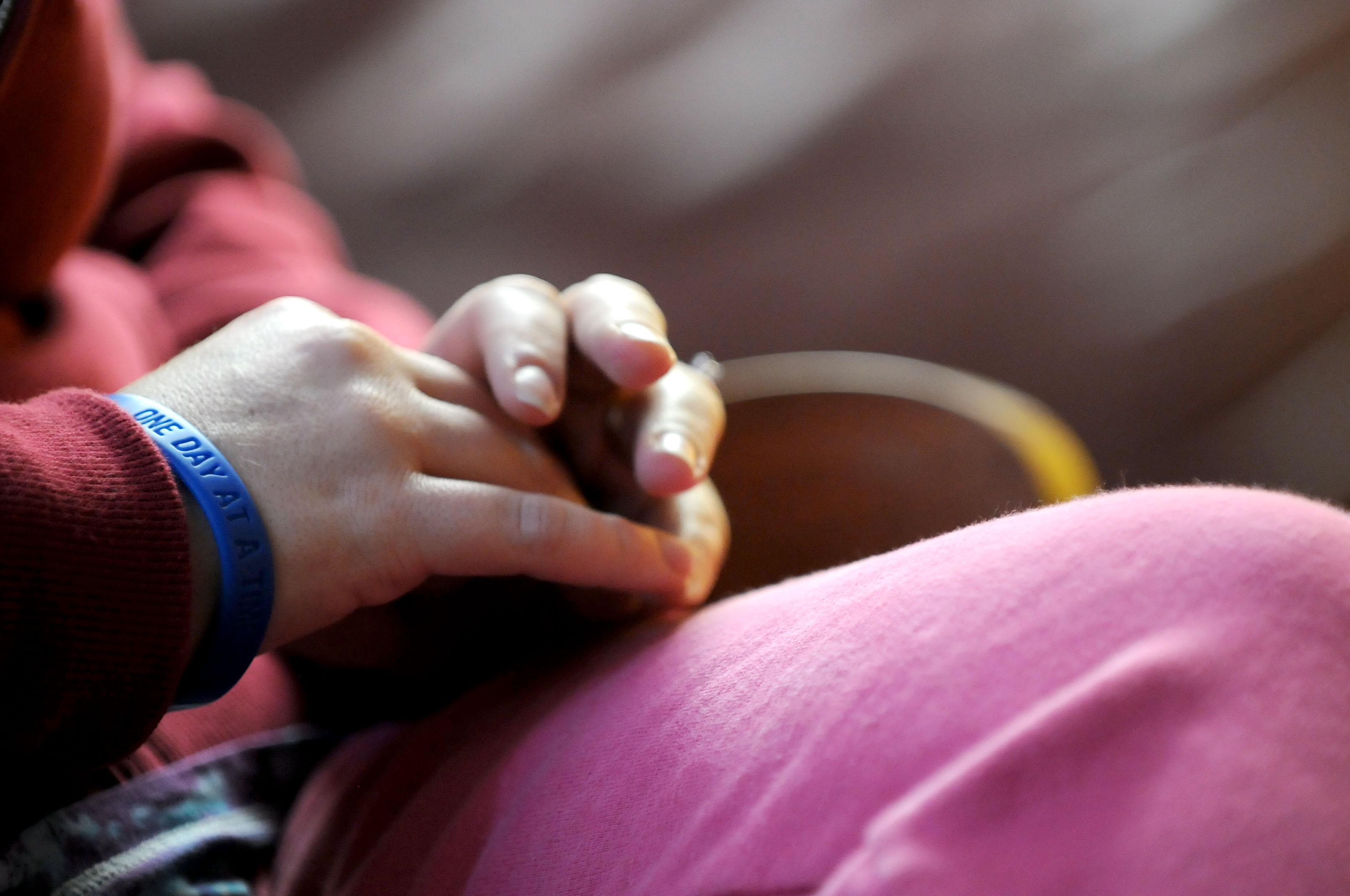 A client at the Decision Point Alcohol and Drug Treatment Services wears a bracelet Thursday Dec. 8, 2011 in Bentonville. The bracelet says, "one day at a time" and provides a constant reminder that she cannot worry about the past or too much about the future.