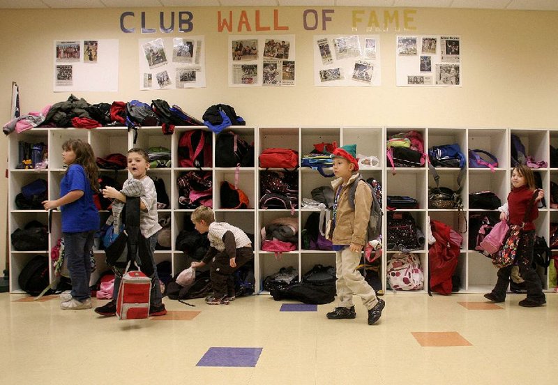 Children arrive at the Boys and Girls Club of Western Benton County in Siloam Springs after school Wednesday. The club lost about $50,000 because of federal budget cuts. 