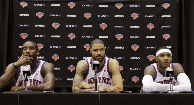 With the acquisition of center Tyson Chandler (center) and the returns of Amar’e Stoudemire (left) and Carmelo Anthony, the New York Knicks have formed their own version of the “Big Three” to challenge the Boston Celtics in the Atlantic Division. 
