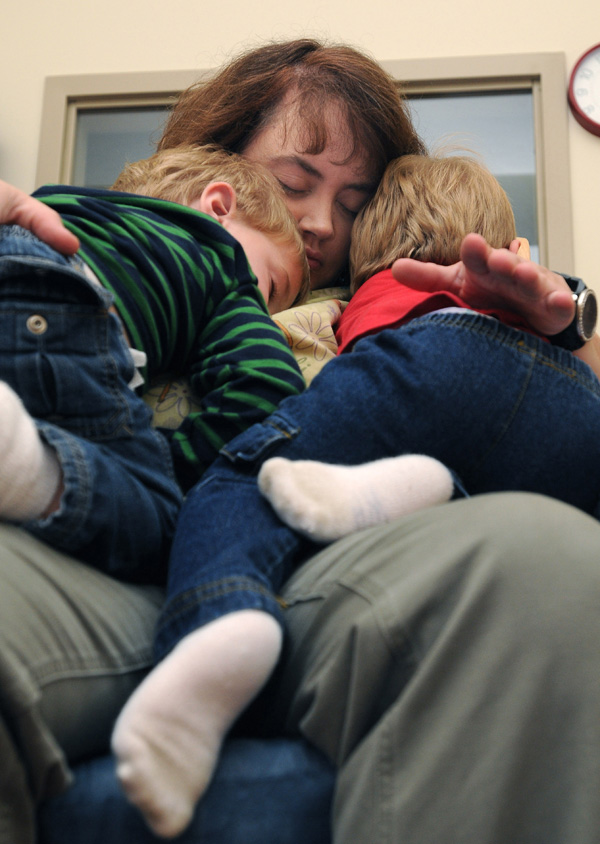 Katrina Lott, center, rocks to sleep twin boys, who cannot be identified, after the boys finished lunch Nov. 30, at the Northwest Arkansas Children’s Shelter in Bentonville. The Northwest Arkansas Children’s Shelter is a temporary home, up to 45 day, for boys ages birth to 12 years old and girls ages birth to 17 years old who have been removed from their home because of neglect, physical abuse or sexual abuse. The shelter, which moved into a newer and bigger facility in April after a $13.5 million grant from the Donald W. Reynolds Foundation, is run by 97 employees and 180 volunteers.