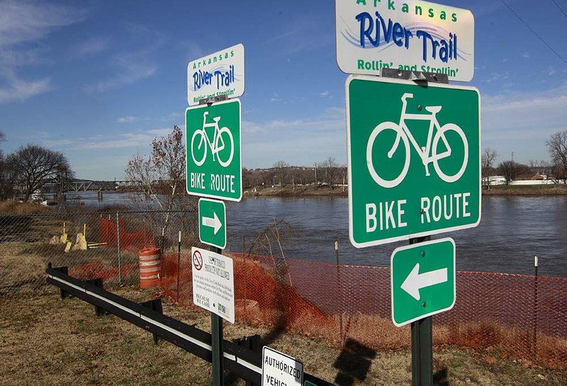 A section of the Arkansas River Trail has a detour sign directing traffic around an area that collapsed into the river during a heavy rain in 2009. The city of Little Rock is taking bids on repairing the 200-foot-long section. 