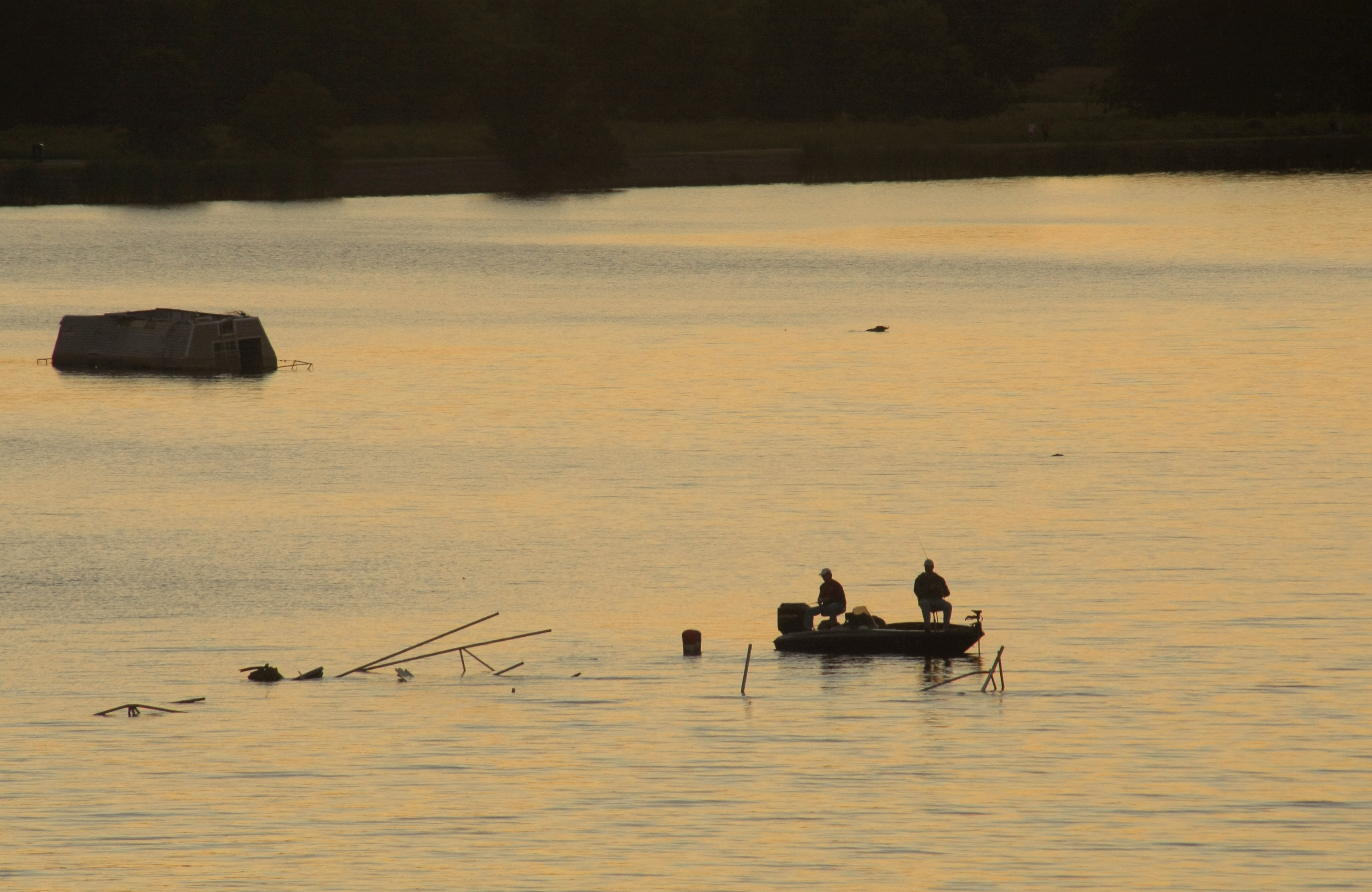Arkansas Democrat-Gazette/JOHN SYKES JR. - Fishermen cast into the waters of the Little Maumelle River on a recent Saturday evening. As seen from the Two Rivers Bridge. 100111