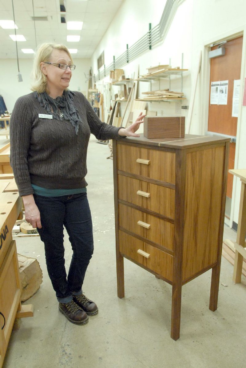 Mia Hall, an assistant professor at the University of Arkansas at Little Rock, teaches woodworking and furniture design as part of the school’s applied design program. Students learn to make simple designs like tables and chairs in their first semester before moving on to cabinets like this one in their second semester. 