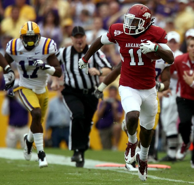 Arkansas Democrat-Gazette/JASON IVESTER --11/25/11--
Arkansas @ LSU football
Arkansas wide receiver Cobi Hamilton speeds down the sideline following a third-quarter reception against Louisiana State at Tiger Stadium in Baton Rouge, La., on Friday, Nov. 25, 2011.