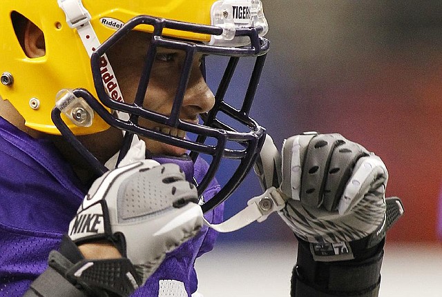 LSU cornerback Tyrann Mathieu looks on during practice for the BCS championship NCAA college football game at the Louisiana Superdome in New Orleans, Thursday, Jan. 5, 2012. LSU announced Mathieu has been dismissed from the team for a violation of team rules. (AP Photo/Bill Haber)
