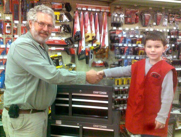David Nelson shakes hands with Joseph Bever (future owner/operator) of Bever’s Ace Hardware.
