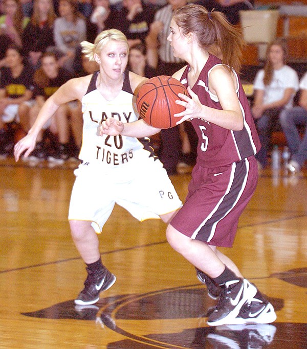 Destiny Thomas looks to pass the ball to a team member during play against Prairie Grove on Friday.

