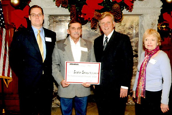 Sulphur Springs Mayor Bob Simon, second from left, was in Little Rock recently where he accepted a $219,000 grant for that city's water and sewer department. Making the presentation was Gov. Mike Beebe, second from right. Also in the photo are representatives from the Arkansas Environmental Development Commission, from which division the grant came.