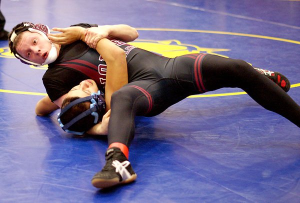 Waiting for the Call — Gentry junior Tyler Easter holds his opponent in position for a fall and waits for the call during wrestling action in Gentry on Saturday.