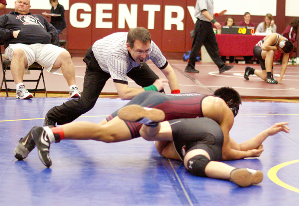 Gentry senior Steven Thao works to obtain a near fall and a spot in the championship round during wrestling action in Gentry on Saturday. Thao finished second in his weight class.