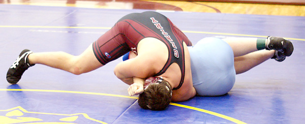 Gentry senior Ben Tuttle makes short work of his opponent Saturday, pinning him early in the match.