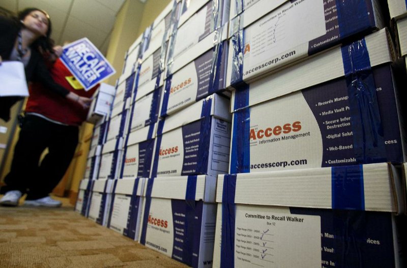 Volunteers from United Wisconsin stack boxes filled with petitions Tuesday in Madison, Wis., to recall Gov. Scott Walker. About 1 million signatures in 128 boxes were delivered to the Wisconsin General Accounting Board. 