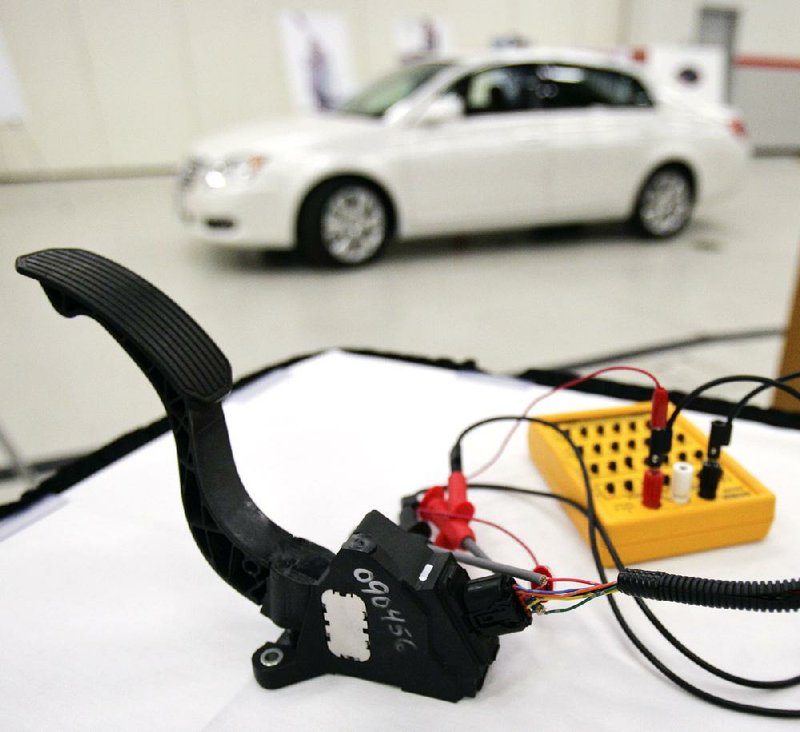 An accelerator pedal from a Toyota vehicle is tested during a news conference at the company’s U.S. sales headquarters in Torrance, Calif., in March 2010. 