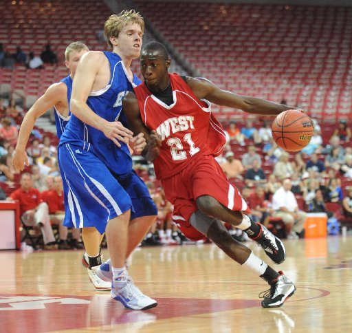 Fred Gulley drives to the basket during the 2009 AHSCA All-Star Game at Bud Walton Arena in Fayetteville. Gulley, who left Oklahoma State last month, has enrolled at Arkansas and hopes to join the Razorbacks' basketball team. 