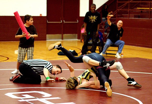 Photo by Randy Moll 
Tyler Easter pins his opponent during wrestling on Friday in Gentry to seal Gentry's victory over Millington Central High School.