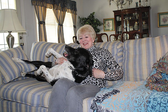 Joyce Pruett and Jake enjoy some play time at their Springdale home.