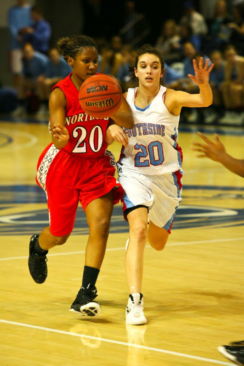 #20 Calli White of Southside slaps the ball away from #20 Bria Caldwell of Northside.