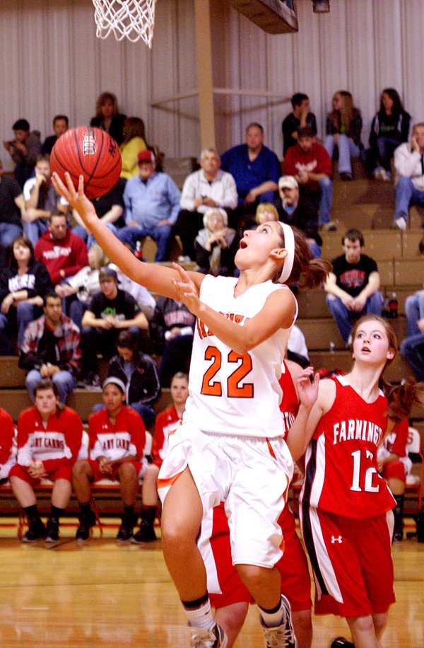 Samantha Pruitt attempts a layup under the basket in play against Farmington on Friday.