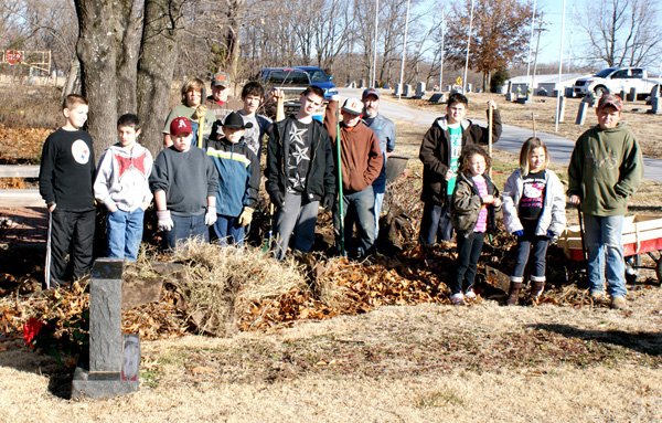 Gravette Gleamers 4-H Club joined forces Saturday in a cleanup project at Hillcrest Cemetery in Gravette.