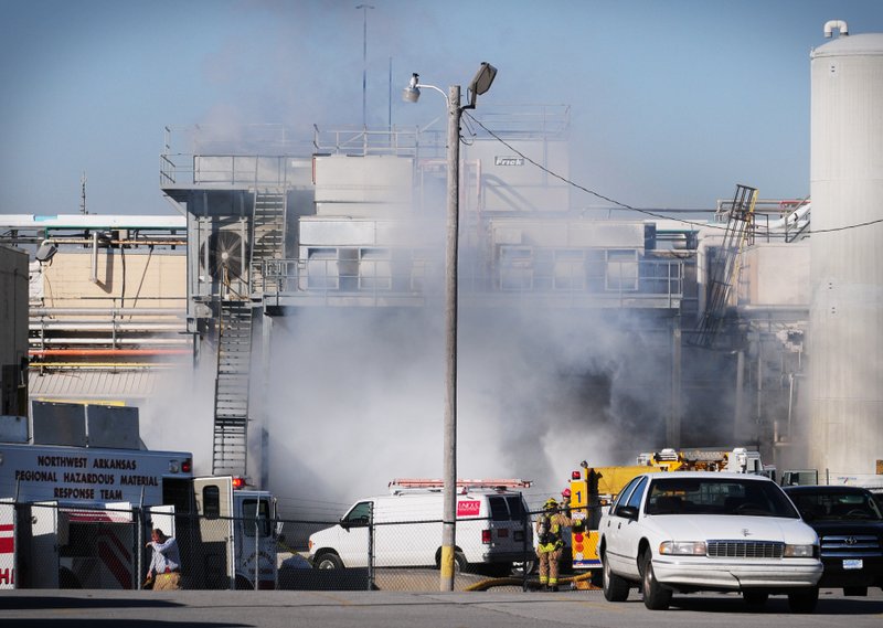 Smoke billows out of an area where firefighters are working to control and ammonia leak, Monday Feb. 6, 2012, at the Cargill Turkey Plant on Randell Wobbe Lane.