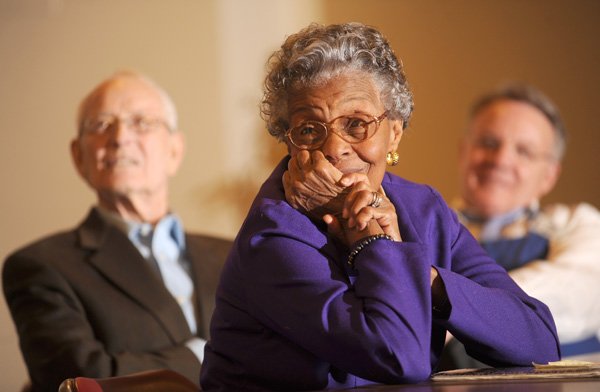 Peggy Taylor Lewis, a member of the first integrated class at Fayetteville High School, smiles Feb. 1 while sitting alongside Harry Vandergriff, left, and Bo Morton during as a part of the Wonderful Wednesdays program series at First United Presbyterian Church in Fayetteville.