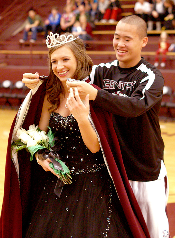 ROYAL TREATMENT Colors Day King Rich Xiong put the royal robe on Kaylin Cripps after she was crowned Colors Day Queen during coronation ceremonies at Gentry High School on Friday. For more Gentry Colors Day photos, see Page 8B.