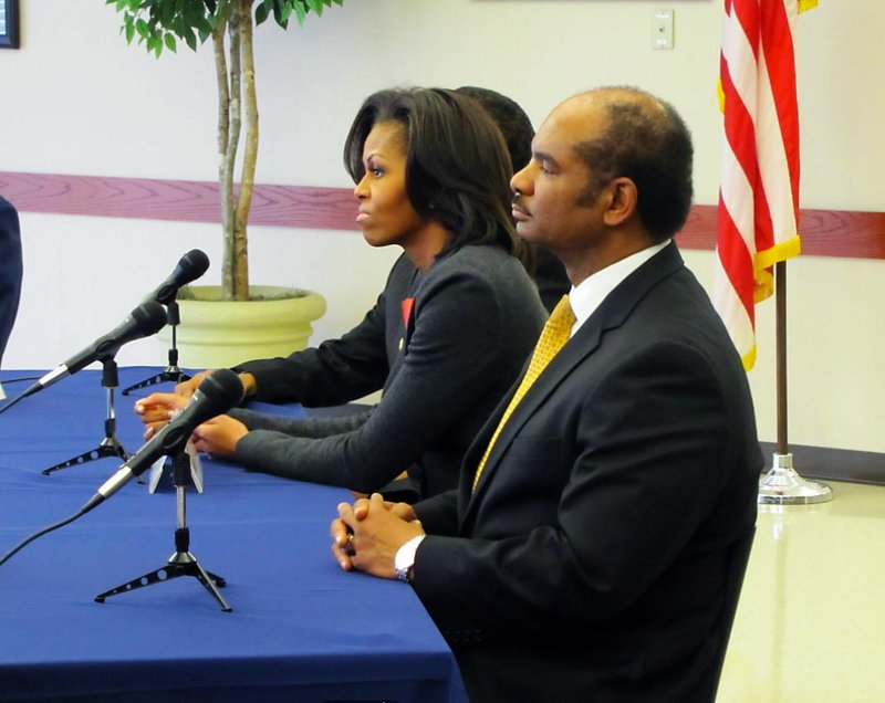 Michelle Obama (left) attends a briefing with Little Rock Air Force Base officials about the success of her "Let's Move!" initiative.