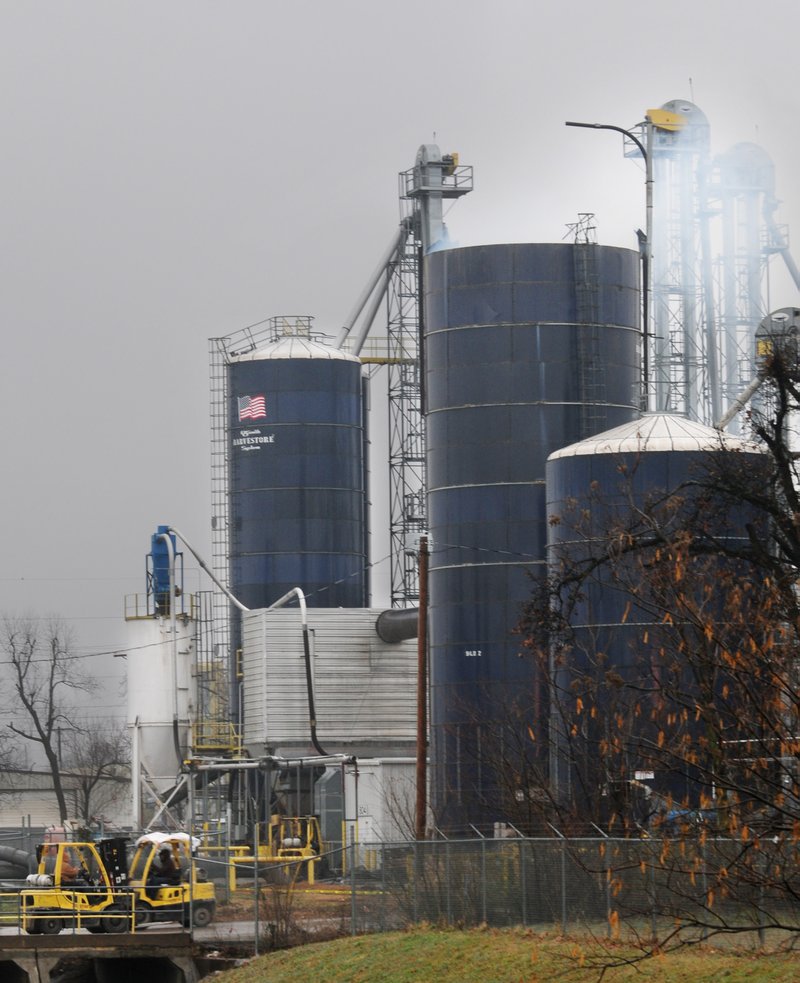 Smoke is seen Friday coming from the top of one of the silos at the AERT plant in Springdale.