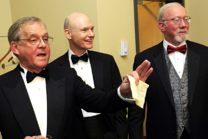 Arkansas Business Hall of Fame inductees John Ed Anthony (left) and Walter E. Hussman Jr. center) visit with the dean of the Sam M. Walton College of Business, Dan Worrell, before being honored at a ceremony Friday night at the Statehouse Convention Center in Little Rock. 