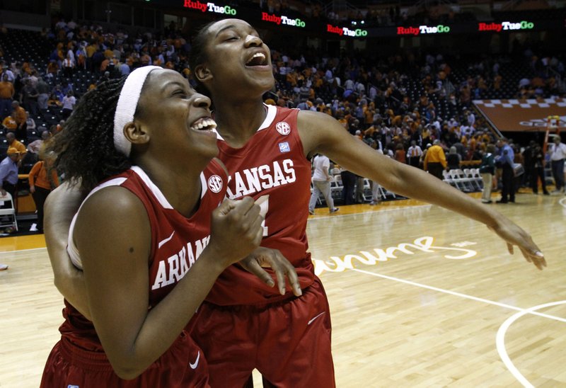 Arkansas' C'eira Ricketts, left, and Dominique Robinson celebrate their 72-71 overtime win over Tennessee in an NCAA college basketball game on Thursday, Feb. 23, 2012, in Knoxville, Tenn. 