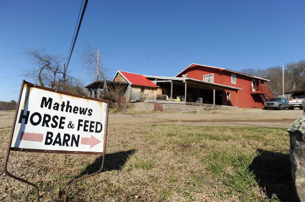 STAFF PHOTO ANDY SHUPE
Neil Mathews and his son, Tony, operate Mathews Horse and Feed Barn in West Fork. Feb. 21, 2012.