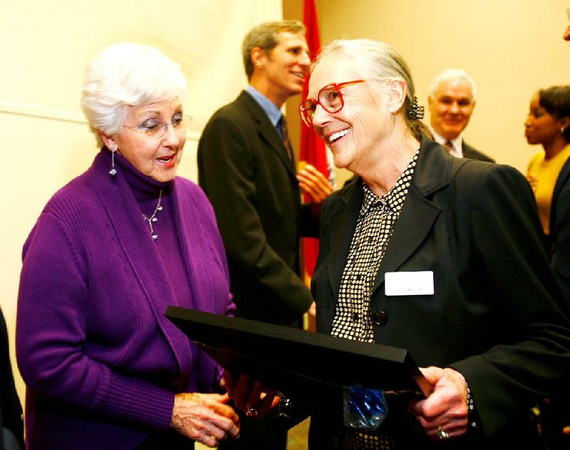 Alice Walton (right), founder of Crystal Bridges of American Art in Bentonville, talks with Northwest Arkansas Community College art student Jenny Wilson after participating in a forum on leadership Monday at the Shewmaker Center for Workforce Technologies on the community college’s Bentonville campus.