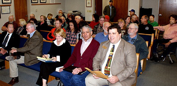 In support of Hiwasse annexation — This shows just part of the crowd of Hiwasse area residents, and others, who attended the annexation hearing in Bentonville Monday morning. Front row from the right, Gravette Mayor Byron Warren, Leon Bertschy, who filed the petition requesting annexation of Hiwasse into Gravette, his wife, Peggy; Larry Kelly, president of the Hiwasse Committee opposing annexation and Jim Parsons, of Bella Vista. Directly behind Warren is Justice of Peace Steve Curry of Gravette. In the back row, from the right are Gravette City Recorder Mike von Ree and Council member Jimmy Denver. Also in attendance were Gravette council members Melissa Smith and Larry Stidham. Shortly after this photo was taken the room filled to standing-room-only, a crowd estimated at almost 100 persons.
