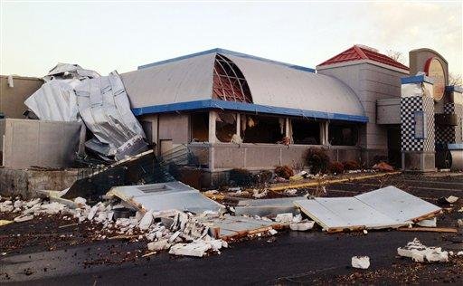 Debris lies around the Midtown Cafe Wednesday, Feb. 29, 2012, in Branson, Mo. A powerful storm system  lashed the Midwest early Wednesday, roughing up the country music resort city of Branson and laying waste to a small town in Kansas.(AP Photo/The News-Leader, Valerie Mosley)