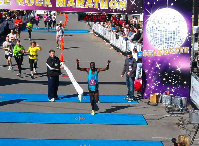 Mark Chepses, 35, crosses the finish line in the Little Rock Marathon Sunday, winning the race and coming in under 2:30. 