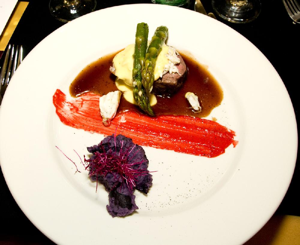 Arkansas Democrat-Gazette/CARY JENKINS
The evening's entree was whole beef tenderloin sliced into medallions, with asparagus spears and lump crab topped with Hollandaise Sauce and served with purple potatoes