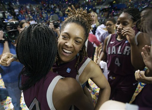 Arkansas-Little Rock's Taylor Ford, center, hugs teammate Taylor Gault, left, as teammate Kiera Clark (4) wipes her eye after the team defeated Middle Tennessee 71-70 in overtime in the Sun Belt Conference tournament final at Summit Arena in March. The conference announces Tuesday that the tournament will be moving from Hot Springs to Lakefront Arena in New Orleans beginning in 2013. 