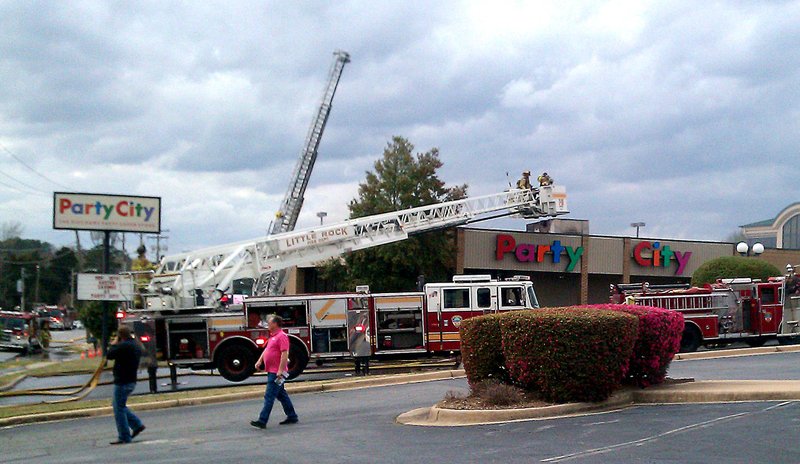 Crews fight a fire at Party City Wednesday.