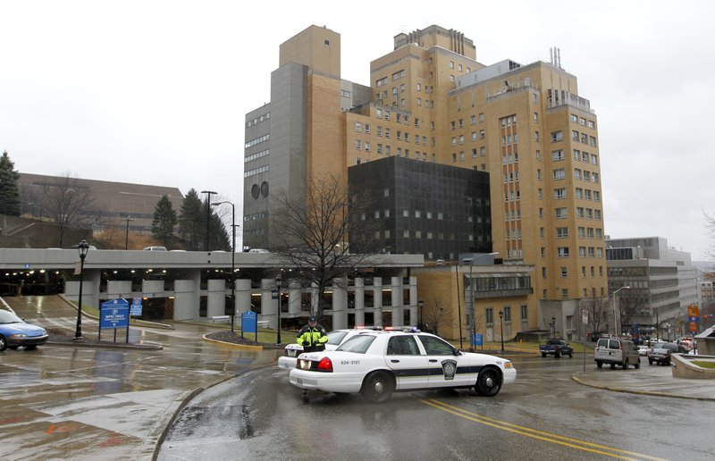 Police block the rear entrance to the Western Psychiatric Institute and Clinic on the University of Pittsburgh campus, Thursday, March 8, 2012 in Pittsburgh.