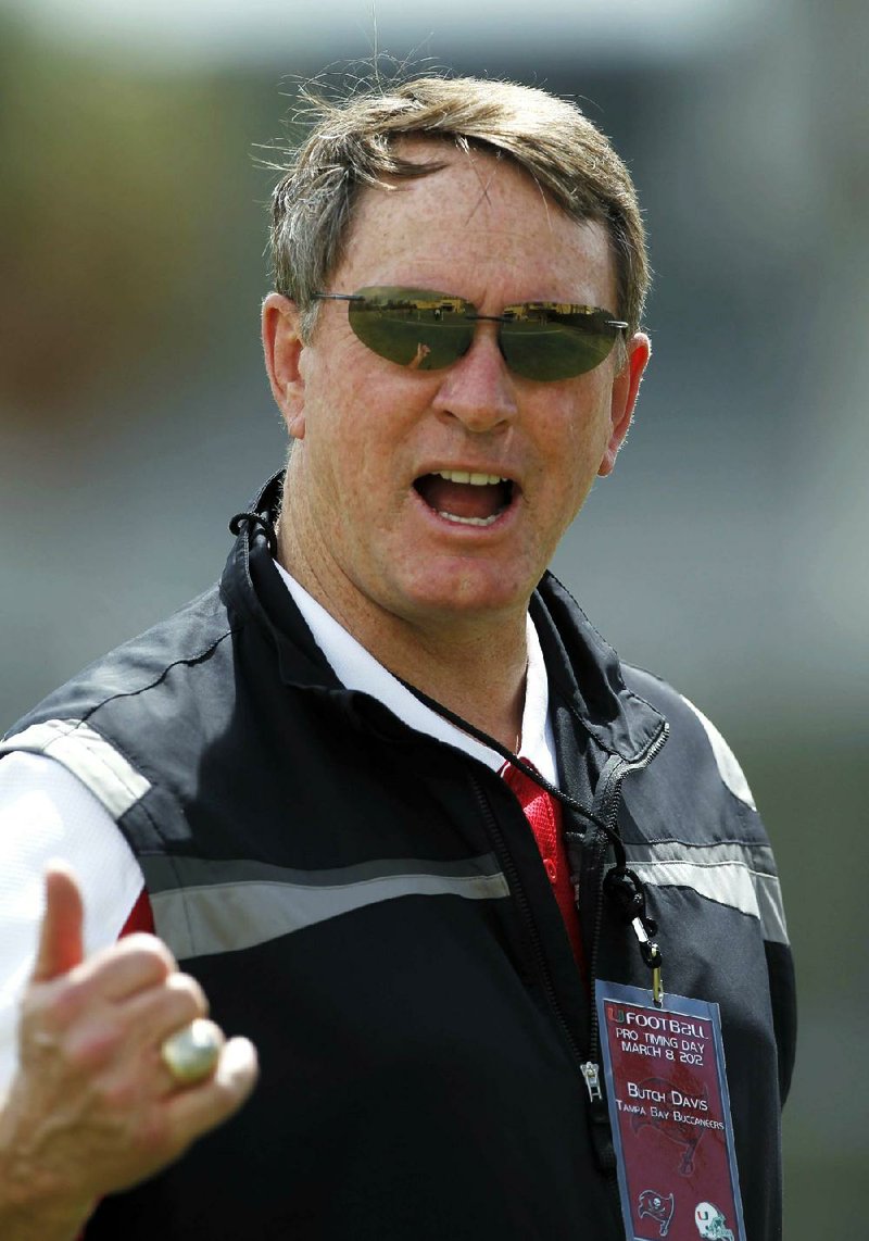 Tampa Bay Buccaneers special assistant Butch Davis gestures to a reporter as he leaves the field during Miami's NFL football pro day workout, Thursday, March 8, 2012, in Coral Gables, Fla. (AP Photo/Alan Diaz)