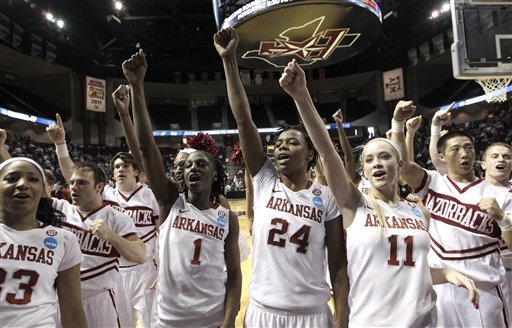 Arkansas' Lyndsay Harris (33), Keira Peak (1), Quistelle Williams (24) and Calli Berna (11) celebrate after defeating Dayton in the first-round college of the NCAA Tournament on Saturday, March 17, 2012, in College Station, Texas. Arkansas defeated Dayton 72-55. (AP Photo/David J. Phillip)