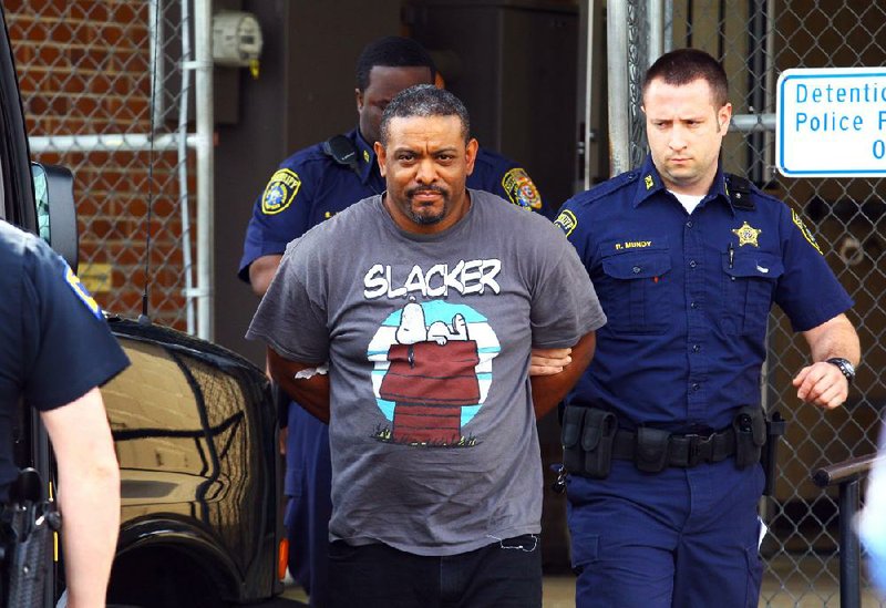 Pulaski County deputies escort Bryce Allen away from court after his arraignment Tuesday morning in Jacksonville in the death of a Jacksonville firefighter. 