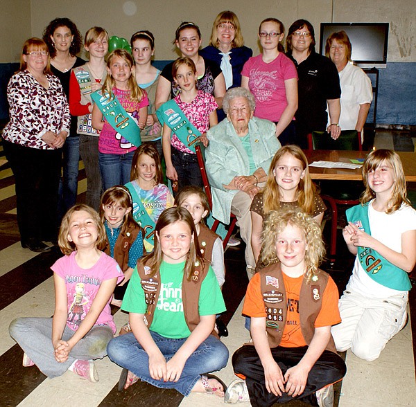 Gravette Girl Scouts celebrated the 100th anniversary of the Girl Scout organization March 12, with their leaders, Elaina Soper, Heather Holland, Lori Johnson, Teresa Reynolds and Nancy Jones. A special guest was Marie Wadleigh, 88, of Bella Vista who became a Girl Scout when she was ten years old.