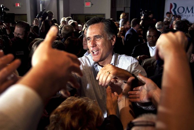 Republican presidential candidate, former Massachusetts Gov. Mitt Romney shakes hands with supporters during a campaign stop at an American Legion post in Arbutus, Md., Wednesday, March 21, 2012. (AP Photo/Steven Senne)